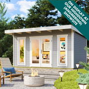 Modern Sicily log cabin with 44mm walls, large glazed doors and tall windows. Ideal for garden offices or outdoor living. Available from Ashdown Garden Buildings.